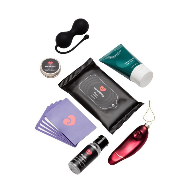 Lubrifiant Womanizer, huile de massage vanille, baume menthol et cartes du calendrier Couples