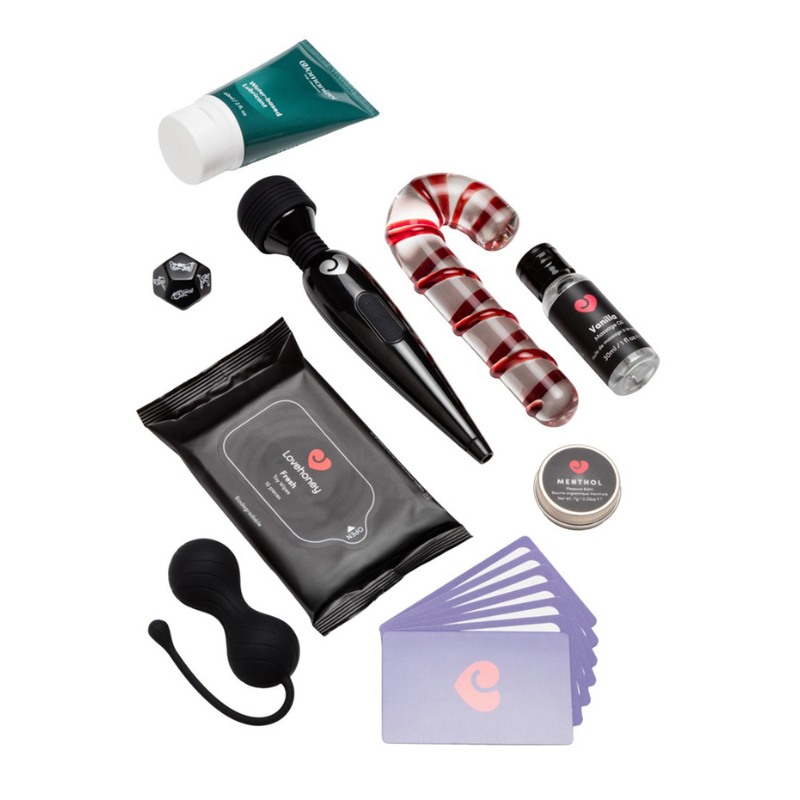 Lubrifiant Womanizer, huile de massage vanille, boules de geisha et jeu de dés Magic Shiver